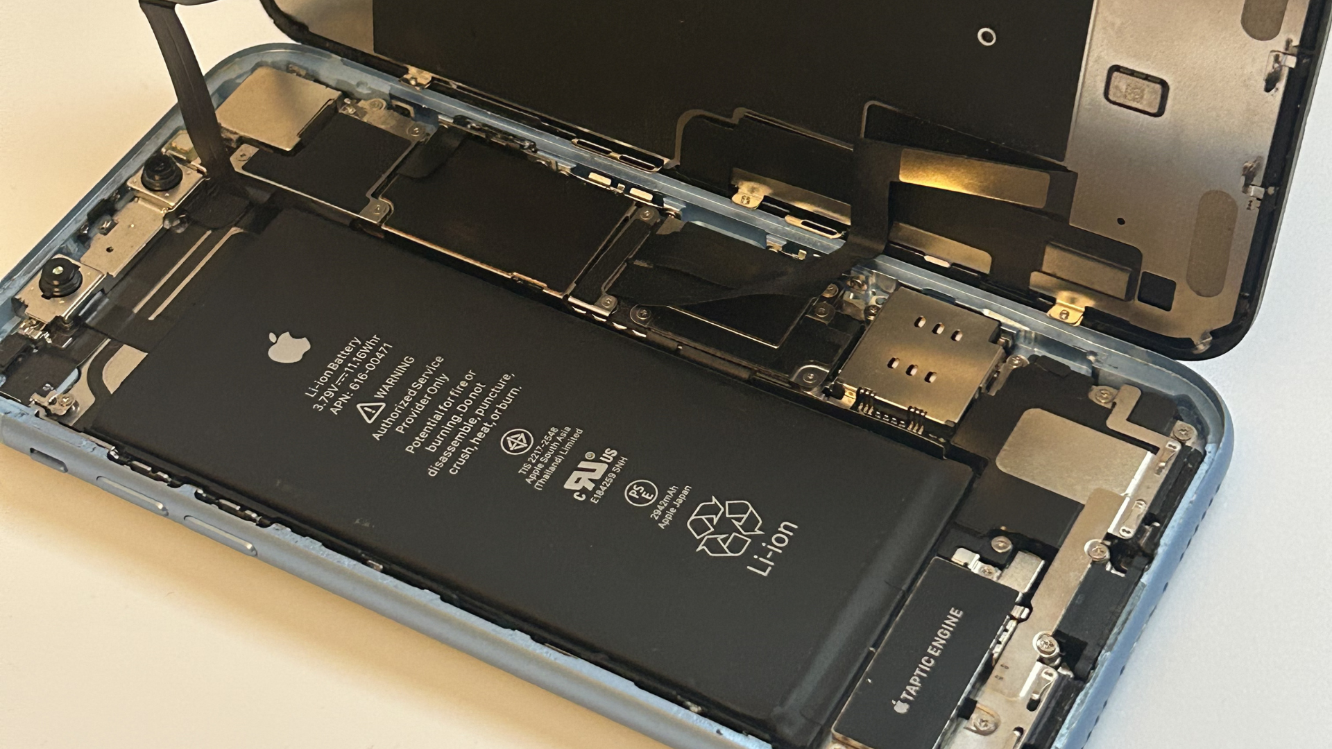 Close-up of the iPhone XR opened up exposing the internal parts