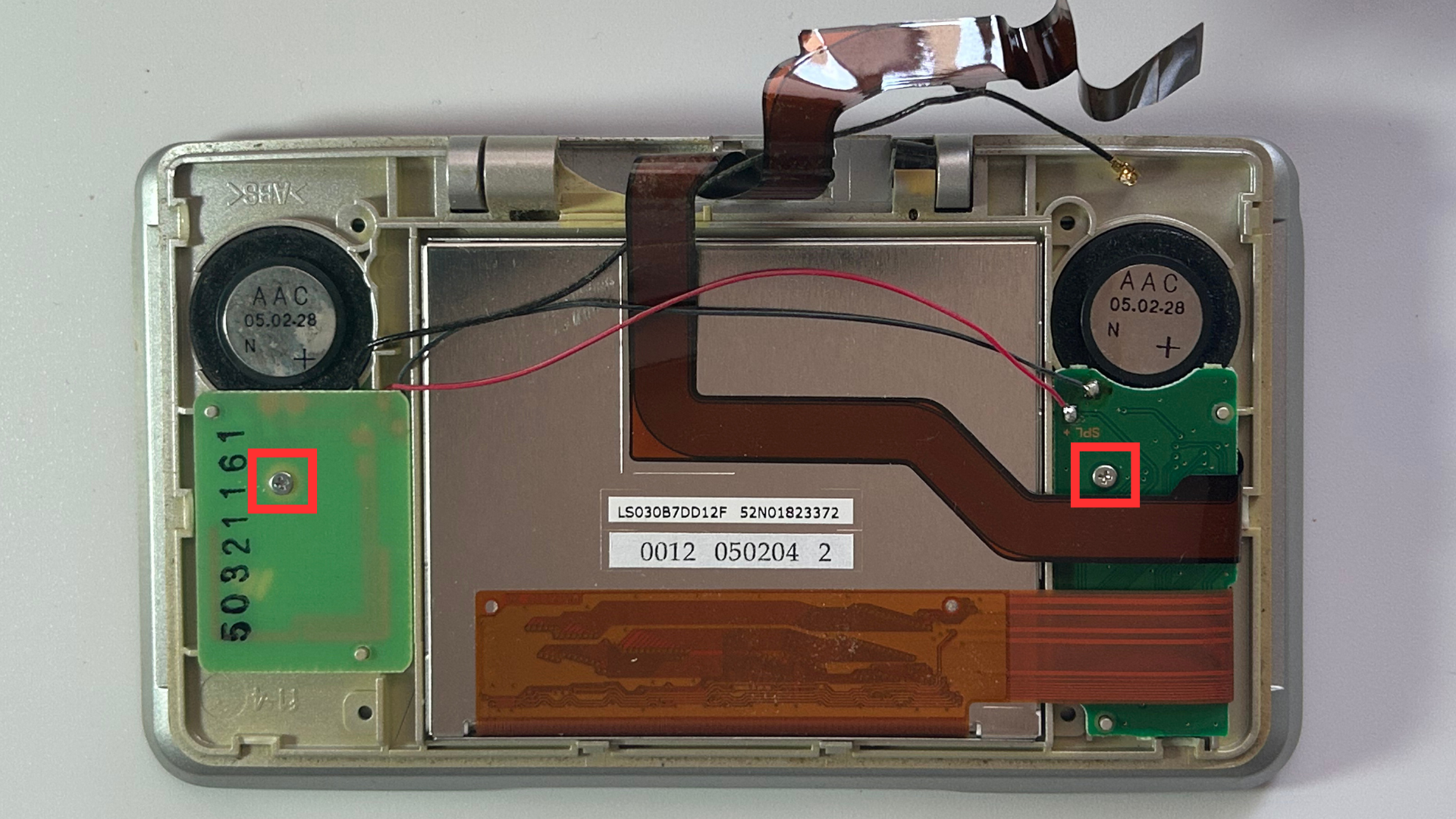 DS Original with rear plate of the top chassis removed, exposing the components