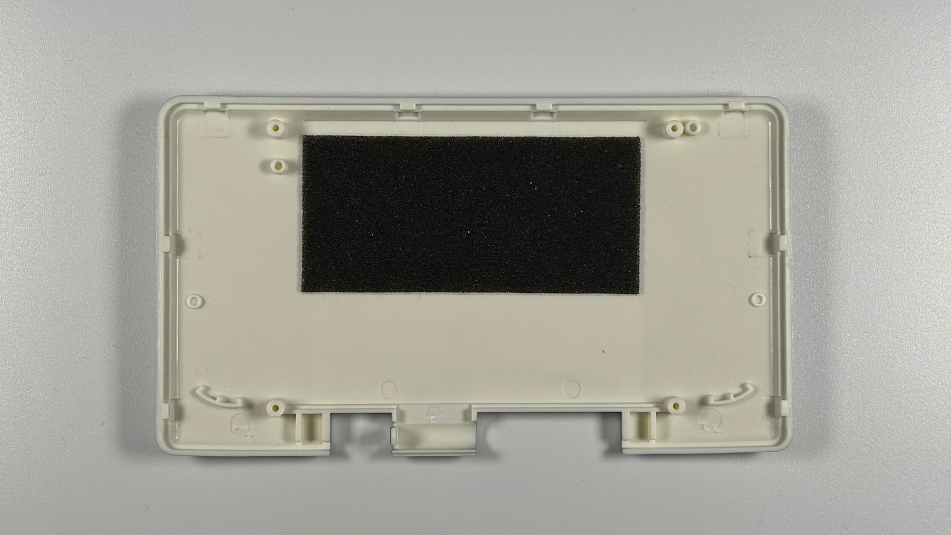 Nintendo DS replacement top shell with screen lens being installed
