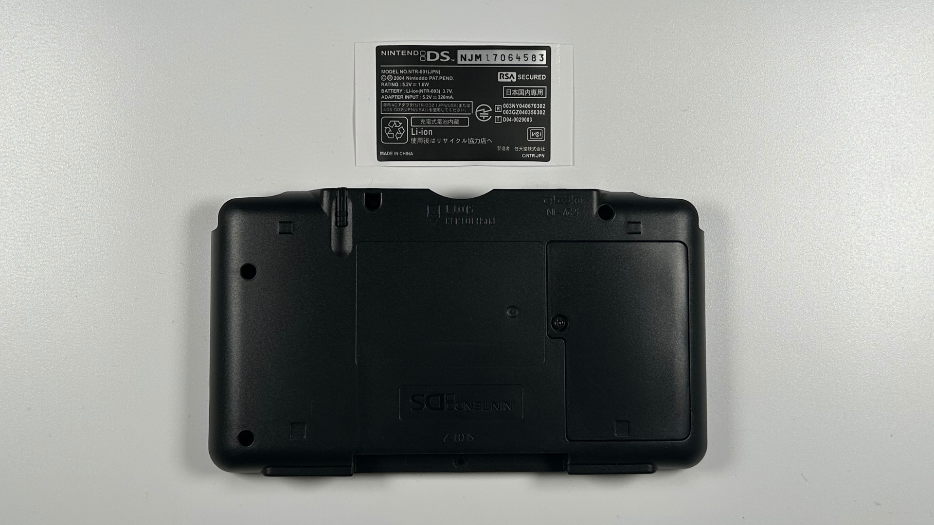 Nintendo DS replacement shell with stickers and trim pieces installed