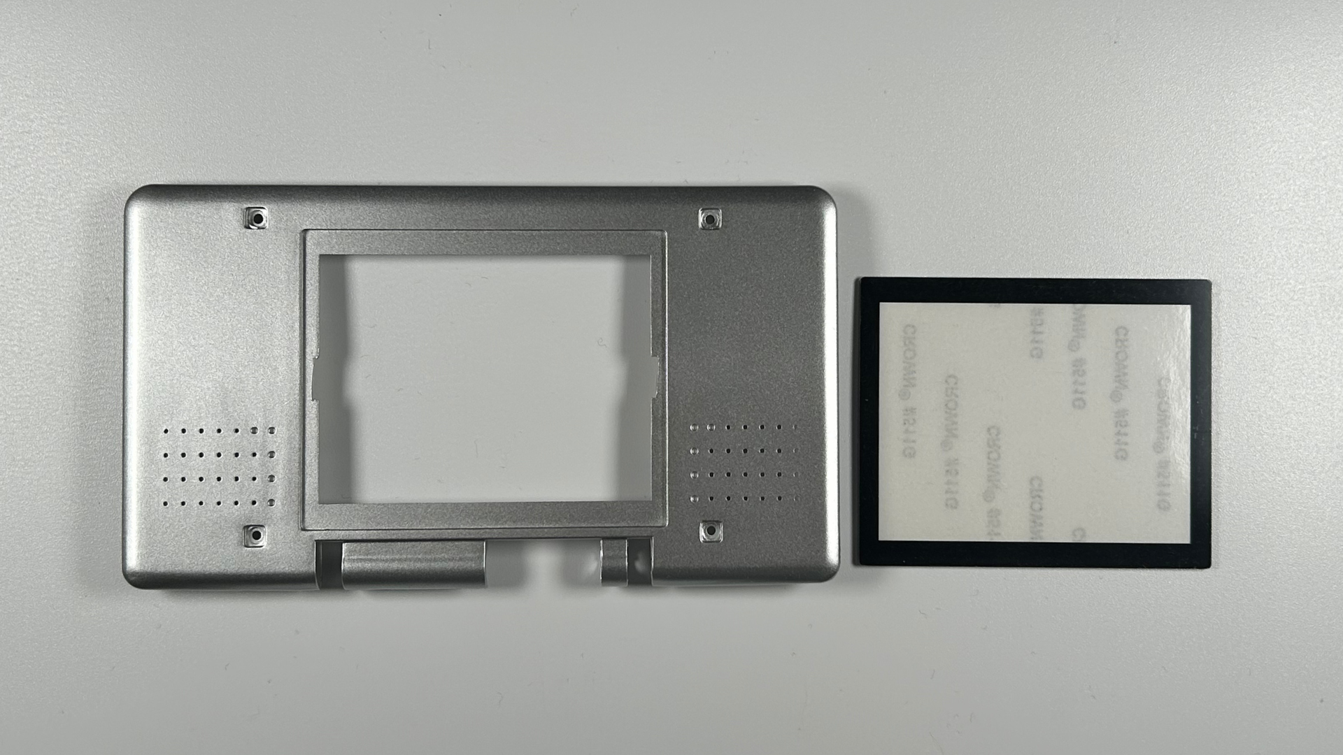 Nintendo DS replacement shell with stickers and trim pieces installed