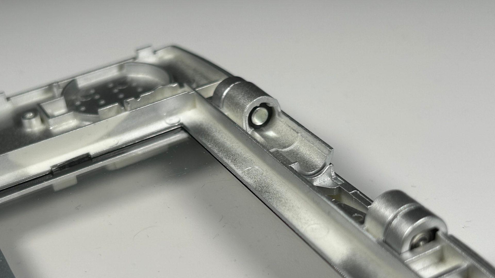 Second hinge piece pushed fully into the replacement shell hinge section