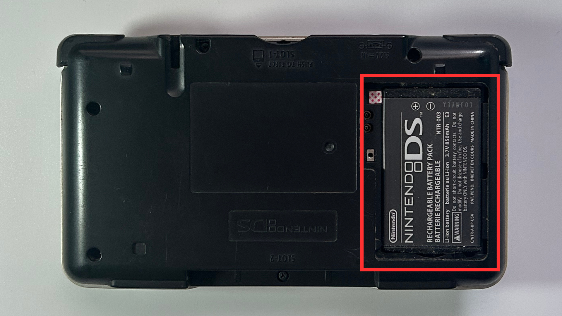 Original Nintendo DS with the battery cover removed
