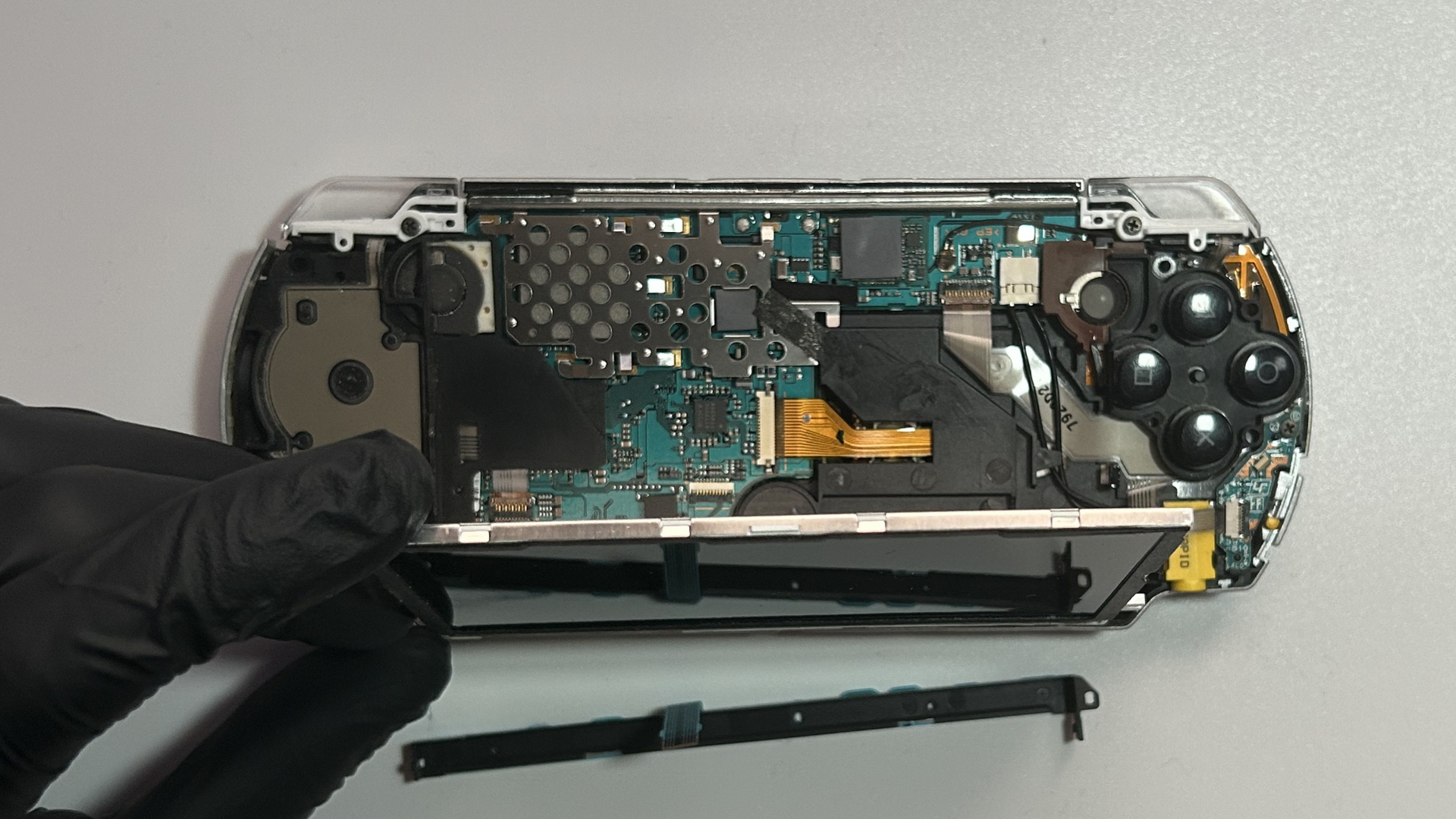 Sony PSP 2000 LCD carefully lifted from the top edge