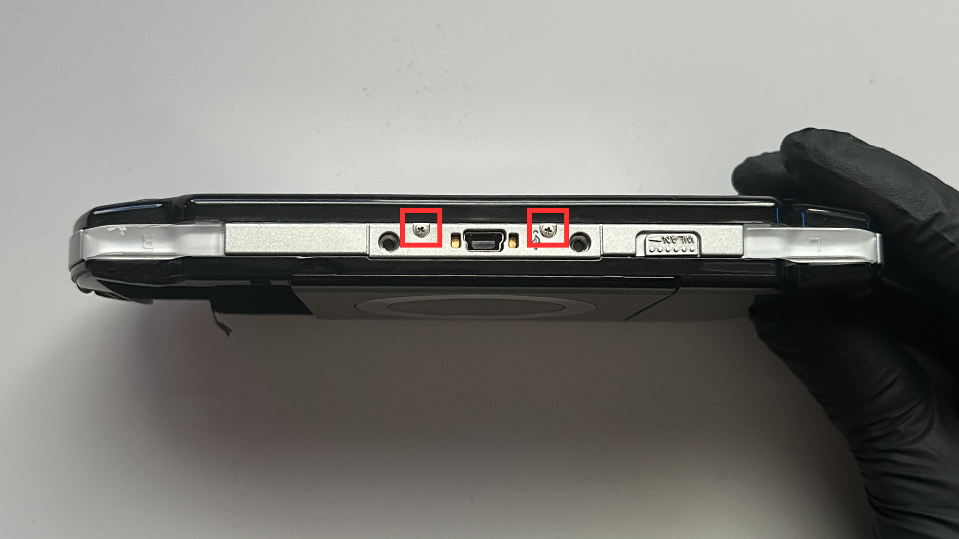 Two screws along the top edge of the Sony PSP 2000