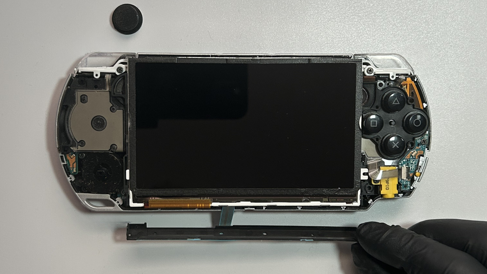 Plastic holding the control buttons flex is loosened from LCD