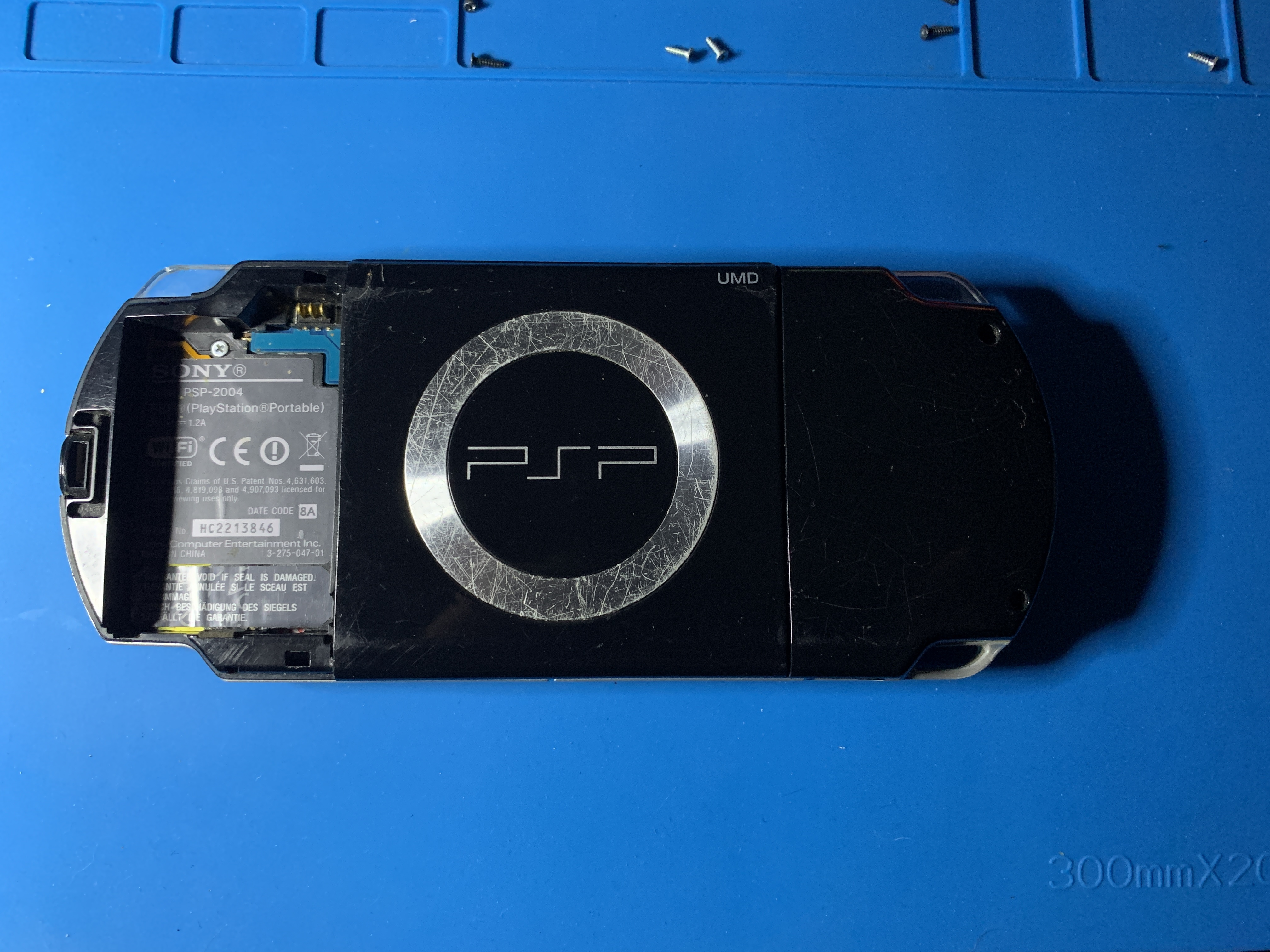 PSP 2000 with rear screws and battery compartment exposed